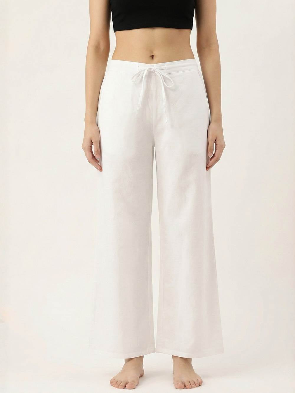 Person wearing white wide-leg pants and a black top on a white background
ksti cotton palazzos