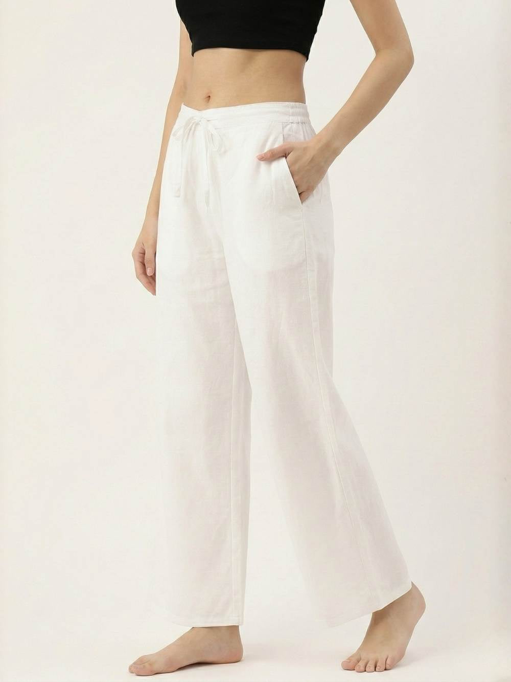 Person wearing white wide-leg pants and a black top on a white background
ksti cotton palazzos
