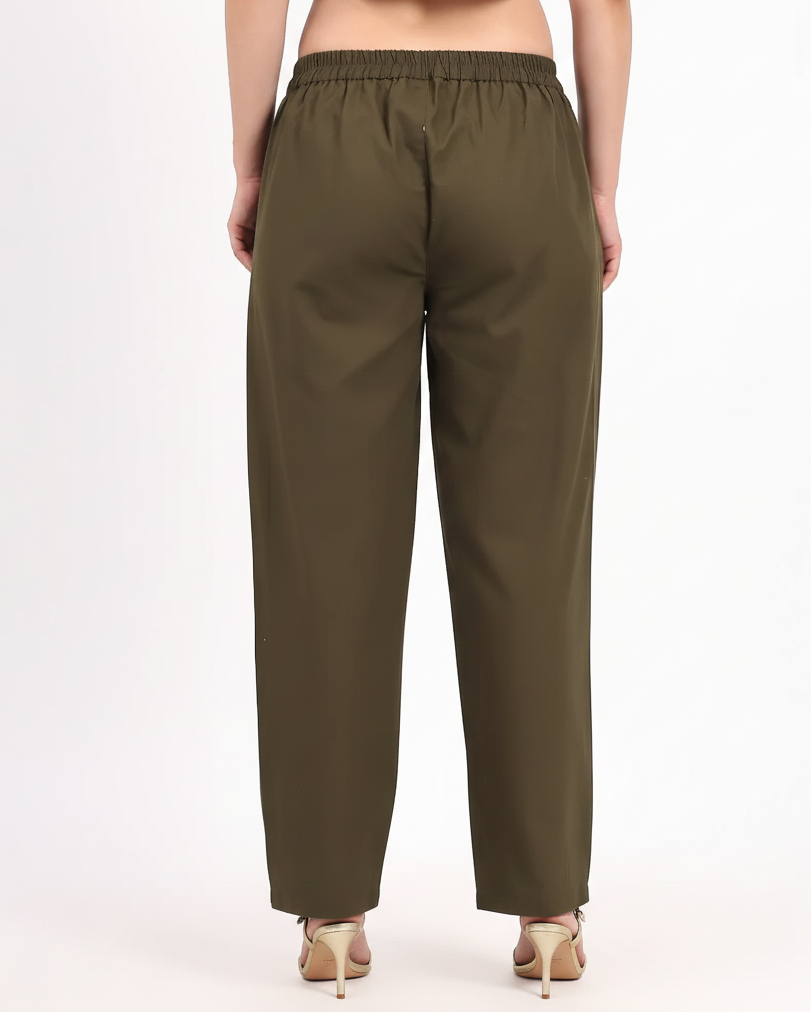 Olive green pants worn by a person on a white background